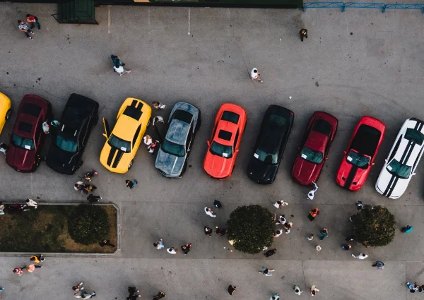 Aerial view of cars arranged in a large parking area