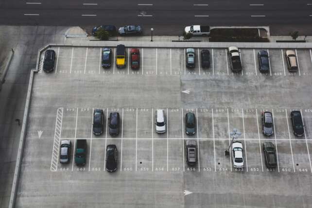 Rows of cars in an outdoor parking facility
