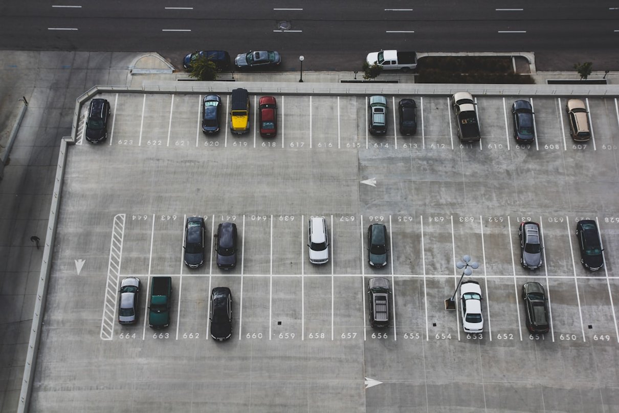 Rows of cars in an outdoor parking facility