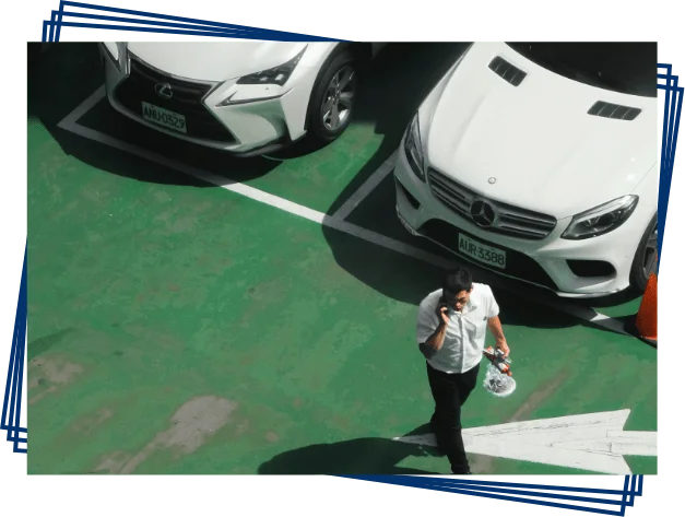 Cars parked in marked bays at an airport parking facility