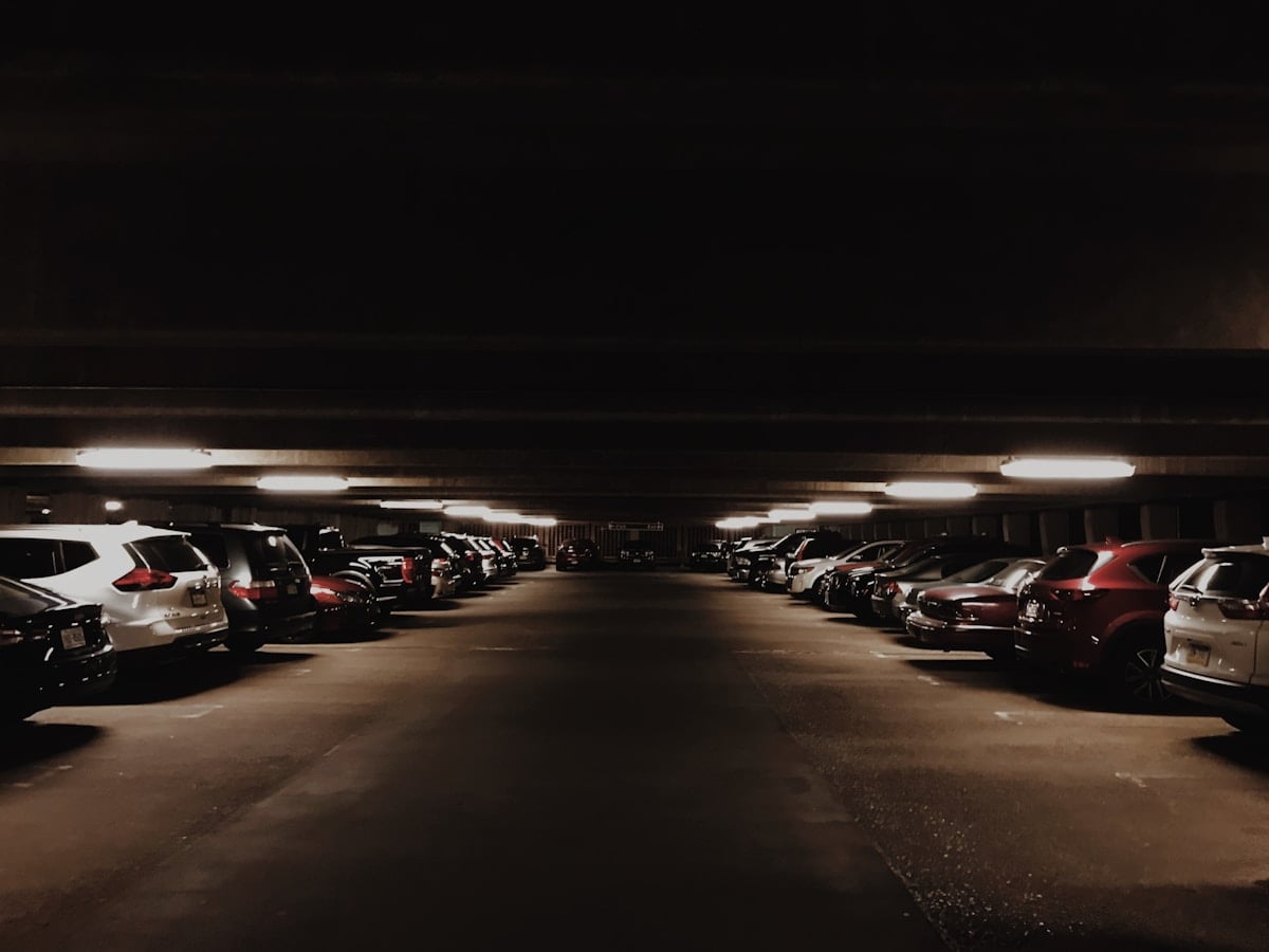 Rows of cars inside a covered multi-storey parking facility