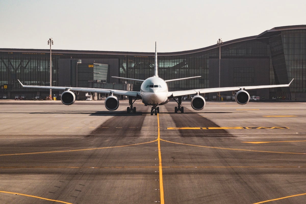 Airport terminal exterior with aircraft