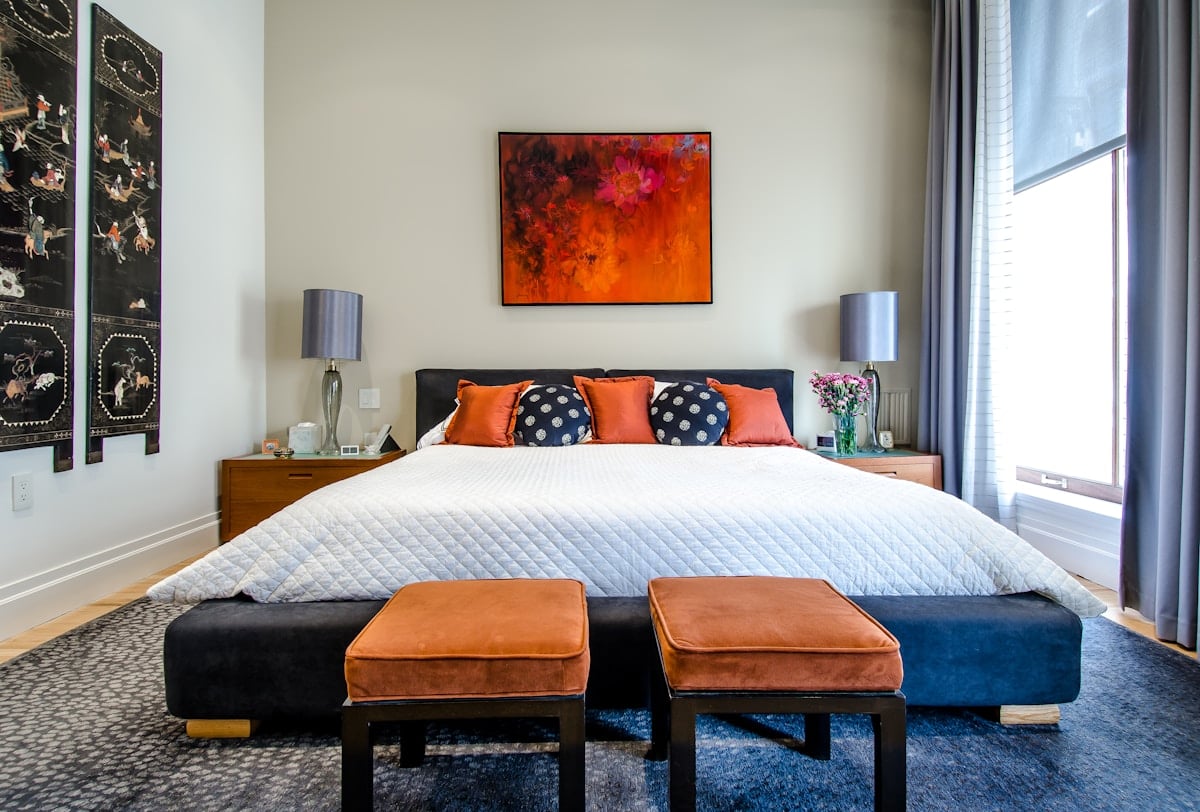 Bedroom with a soft upholstered bed and natural light