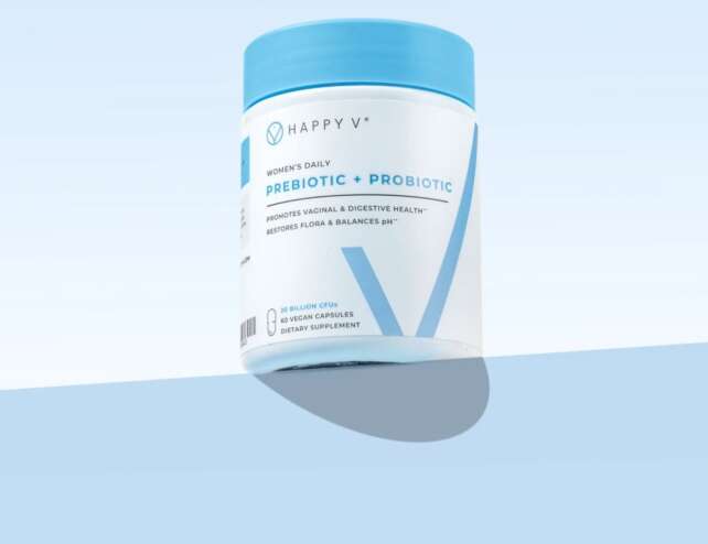 Happy V Prebiotic + Probiotic bottle on a blue background
