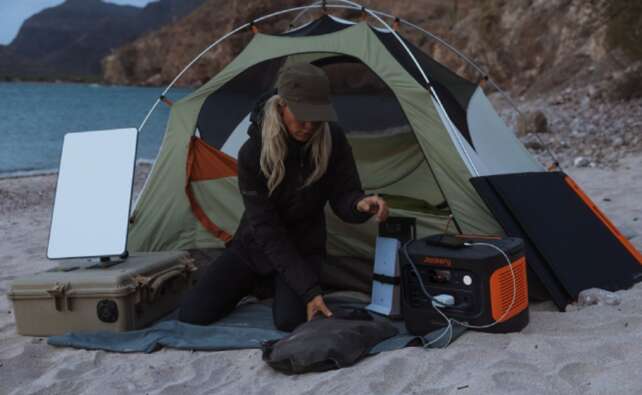 Jackery portable power station used for winter camping in a UK outdoor setting