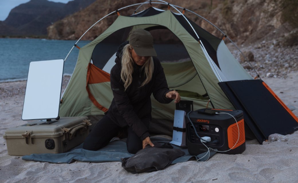 Jackery portable power station used for winter camping in a UK outdoor setting