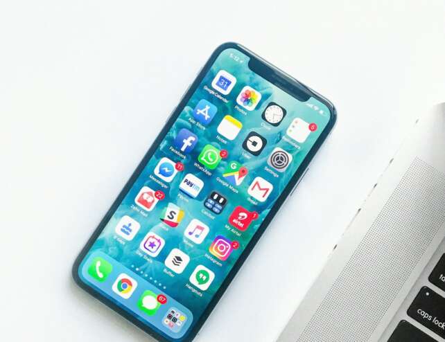 Smartphone resting on a desk in a lifestyle scene
