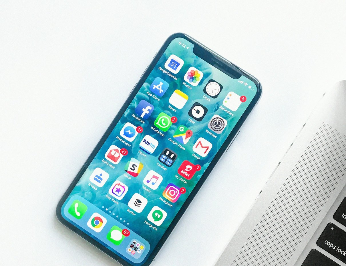 Smartphone resting on a desk in a lifestyle scene