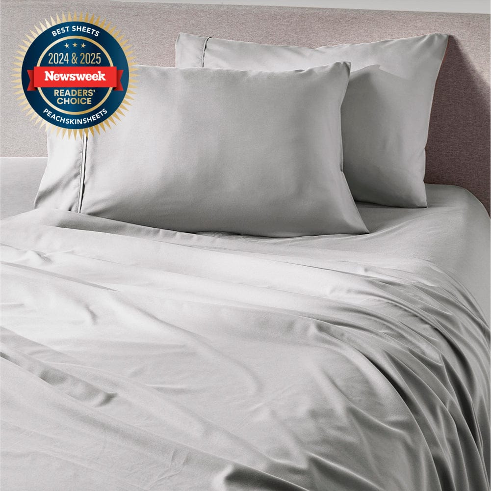 Brushed Silver Sheet Set styled on a bed