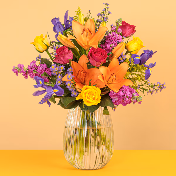 Floral Ratatouille bouquet with colourful lilies roses and irises