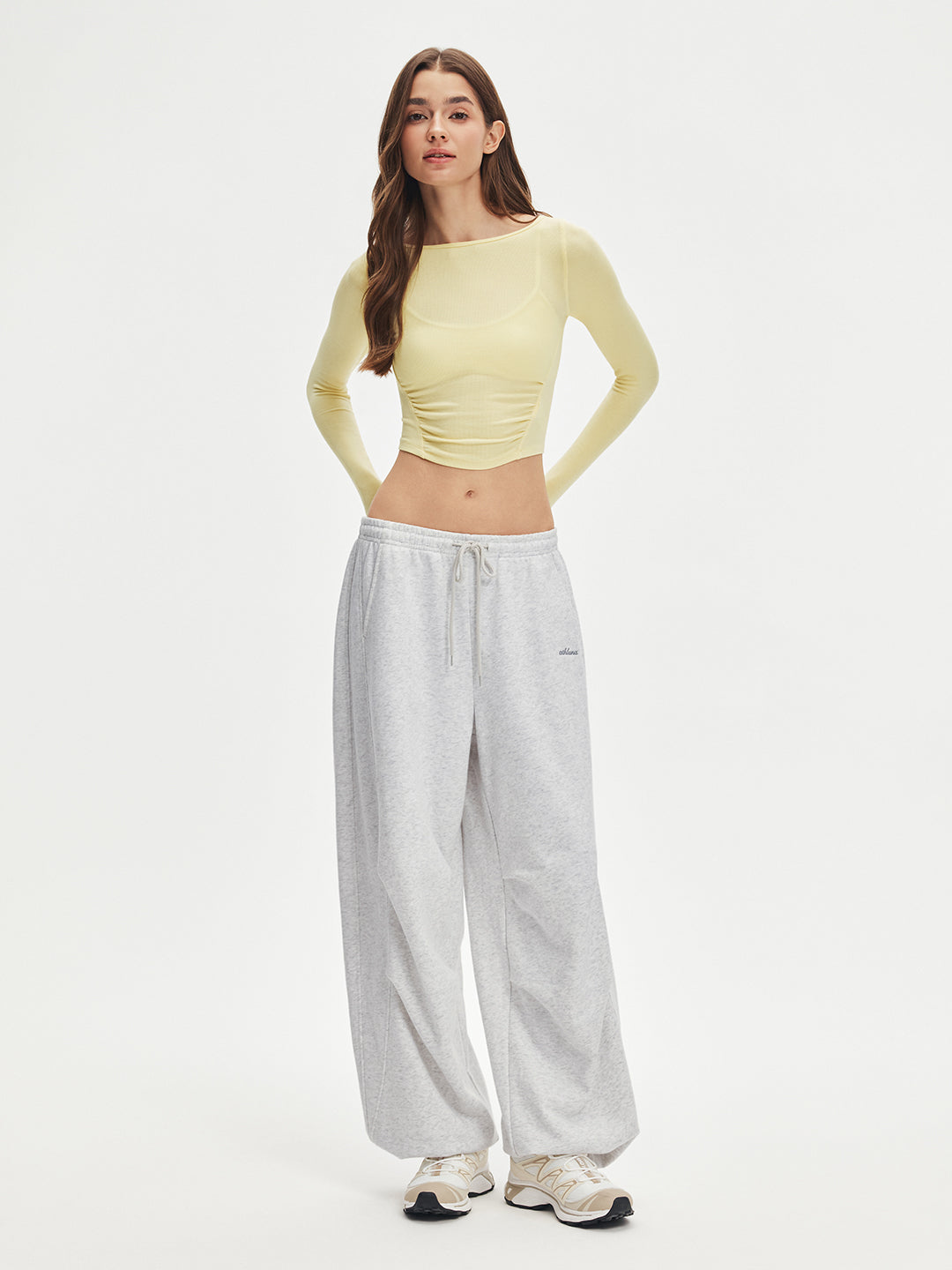 Model wearing adjustable hem parachute sweatpants from ShopAthluna Affiliate