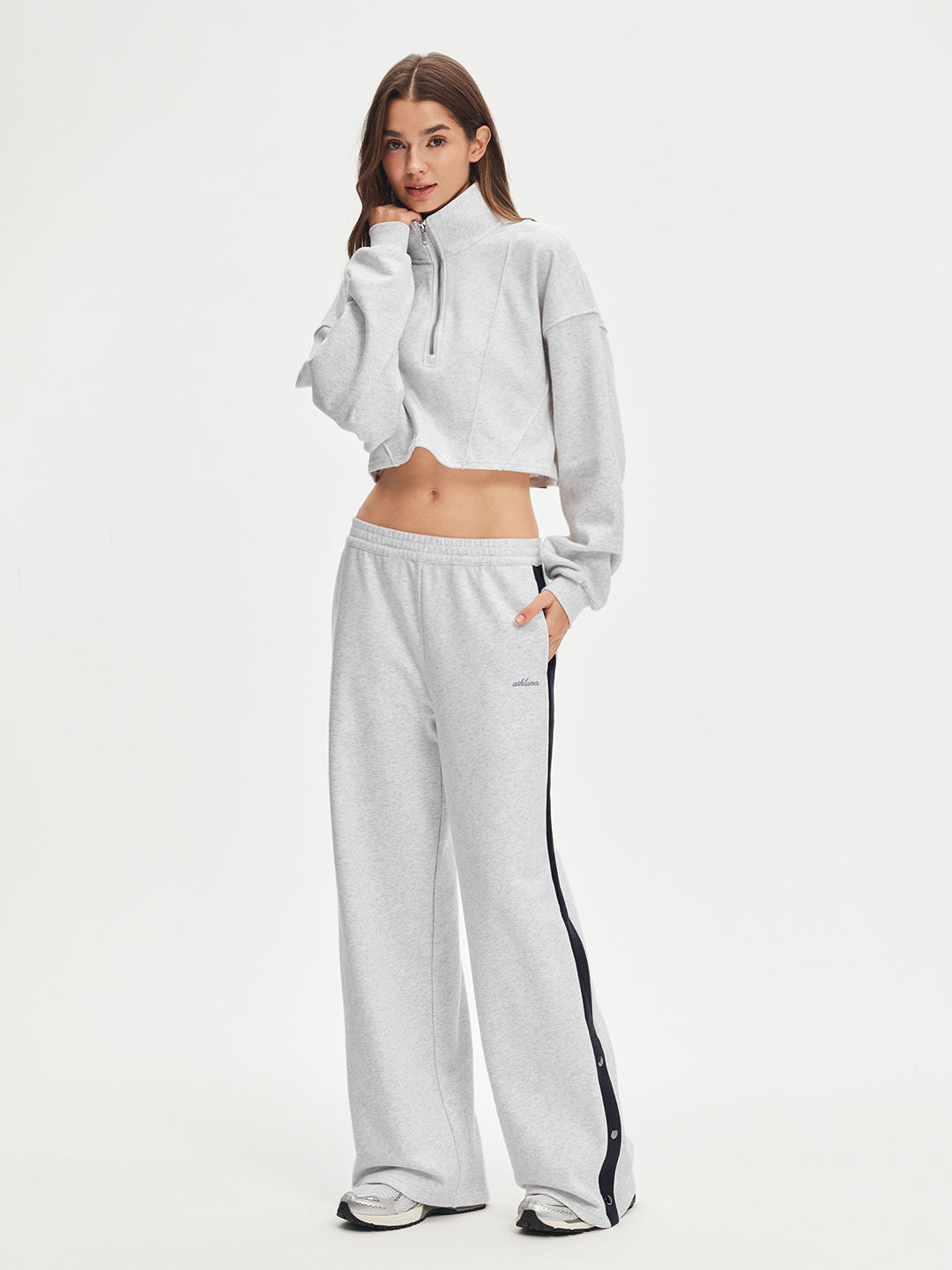 Model wearing side stripe snap button straight sweatpants from ShopAthluna Affiliate