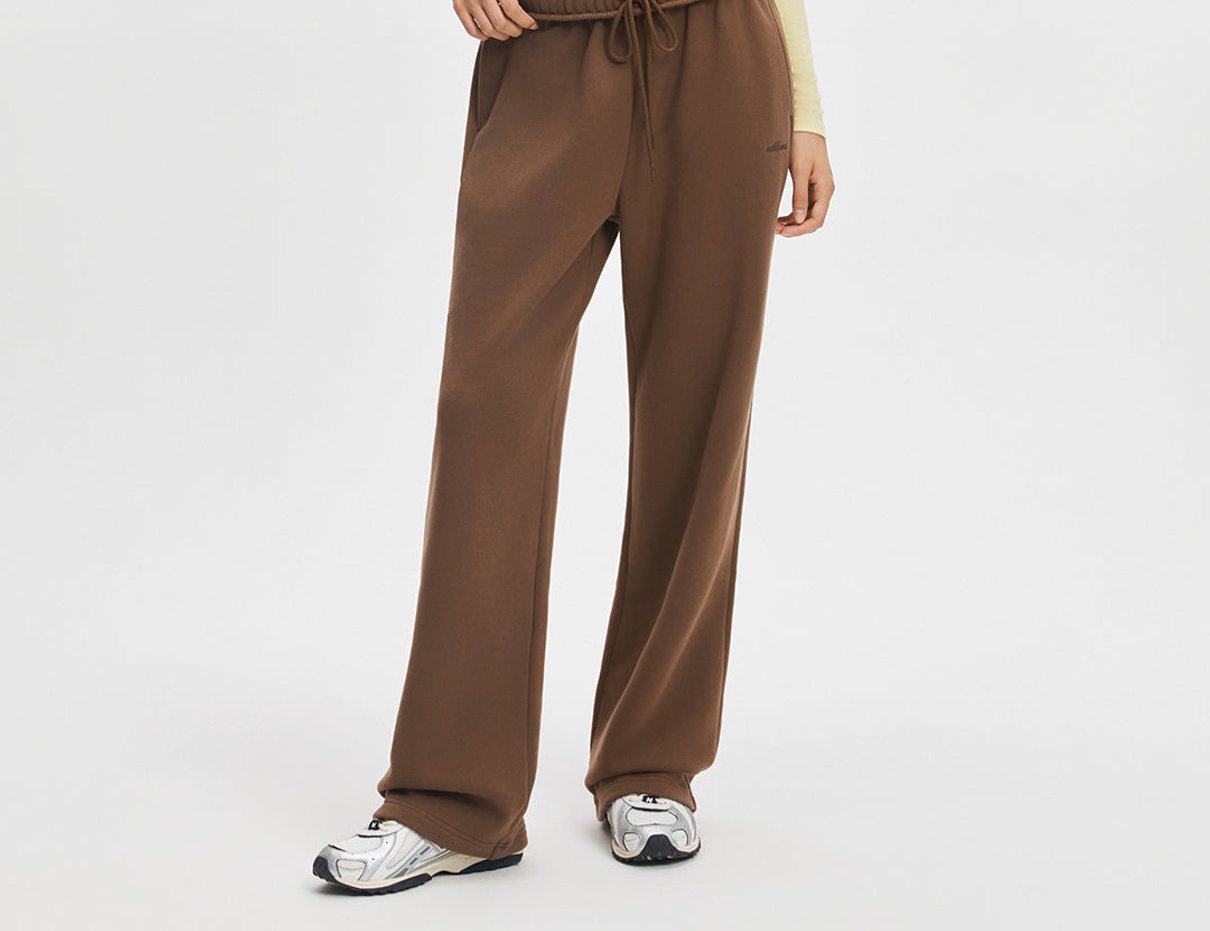 Model wearing mocha wide leg sweatpants from ShopAthluna Affiliate