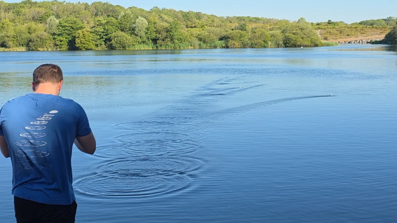 Person beside a lake in a Faith In Nature editorial
