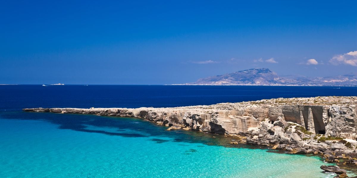 Rocky coast and water at Cala Rossa on Favignana