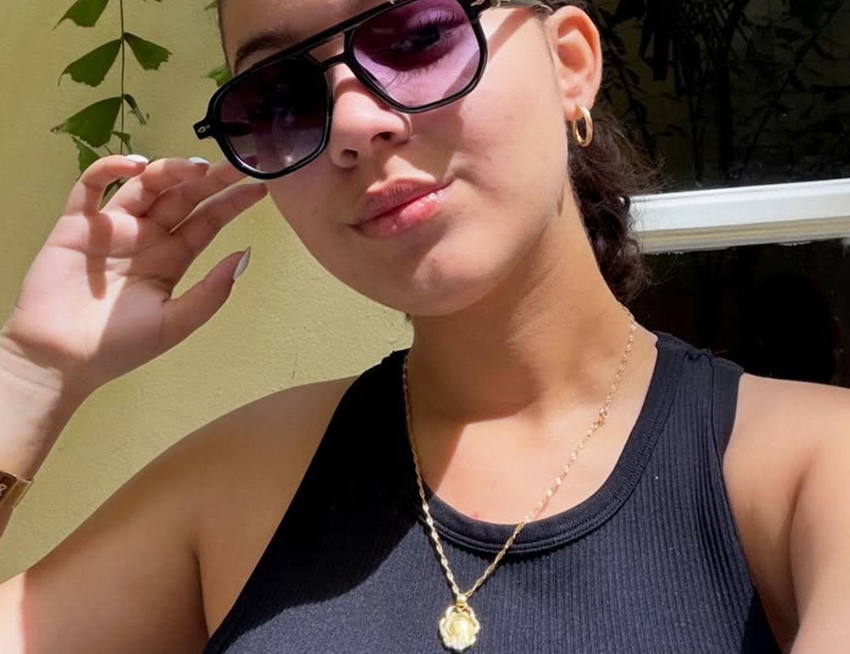 Woman wearing dark tinted sunglasses outdoors