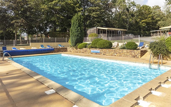 Outdoor swimming pool at Château Lez Eaux campsite
