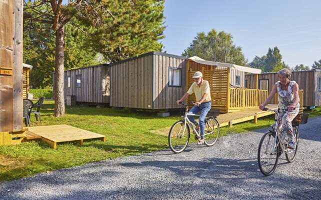 Holidaymakers cycling at the Riva Bella holiday park