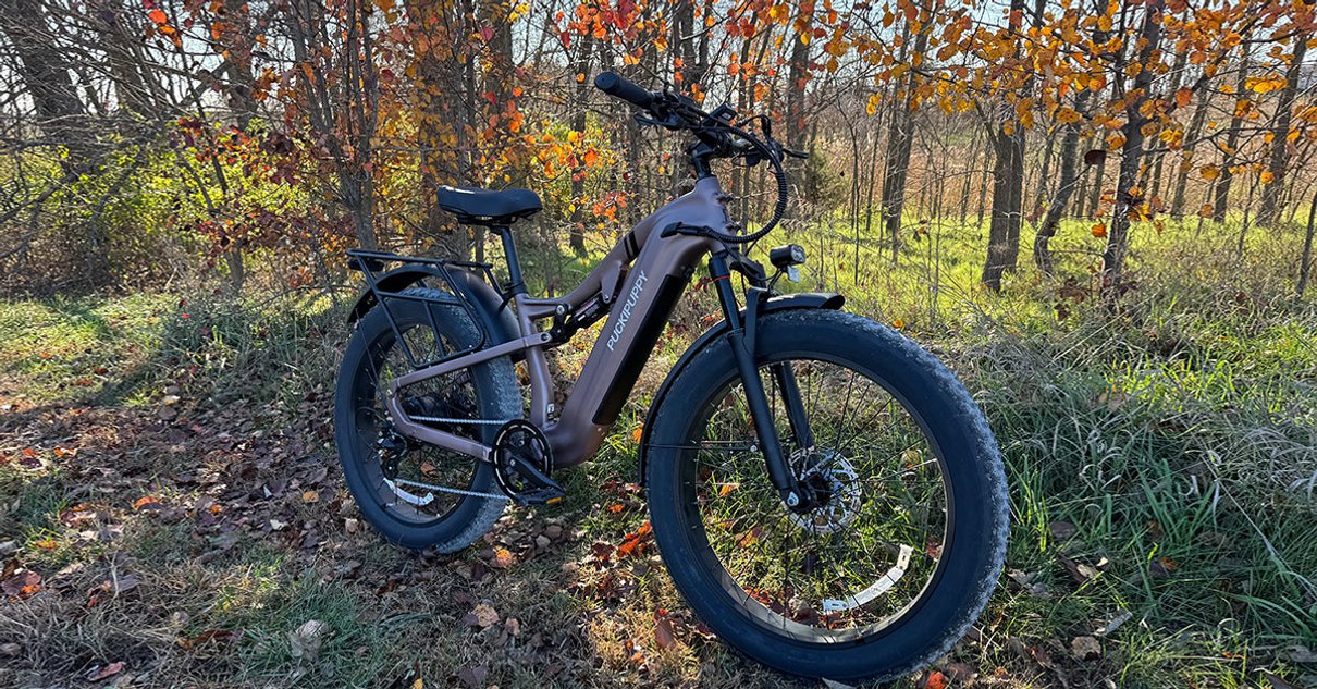 Puckipuppy fat tire electric bike in a woodland setting