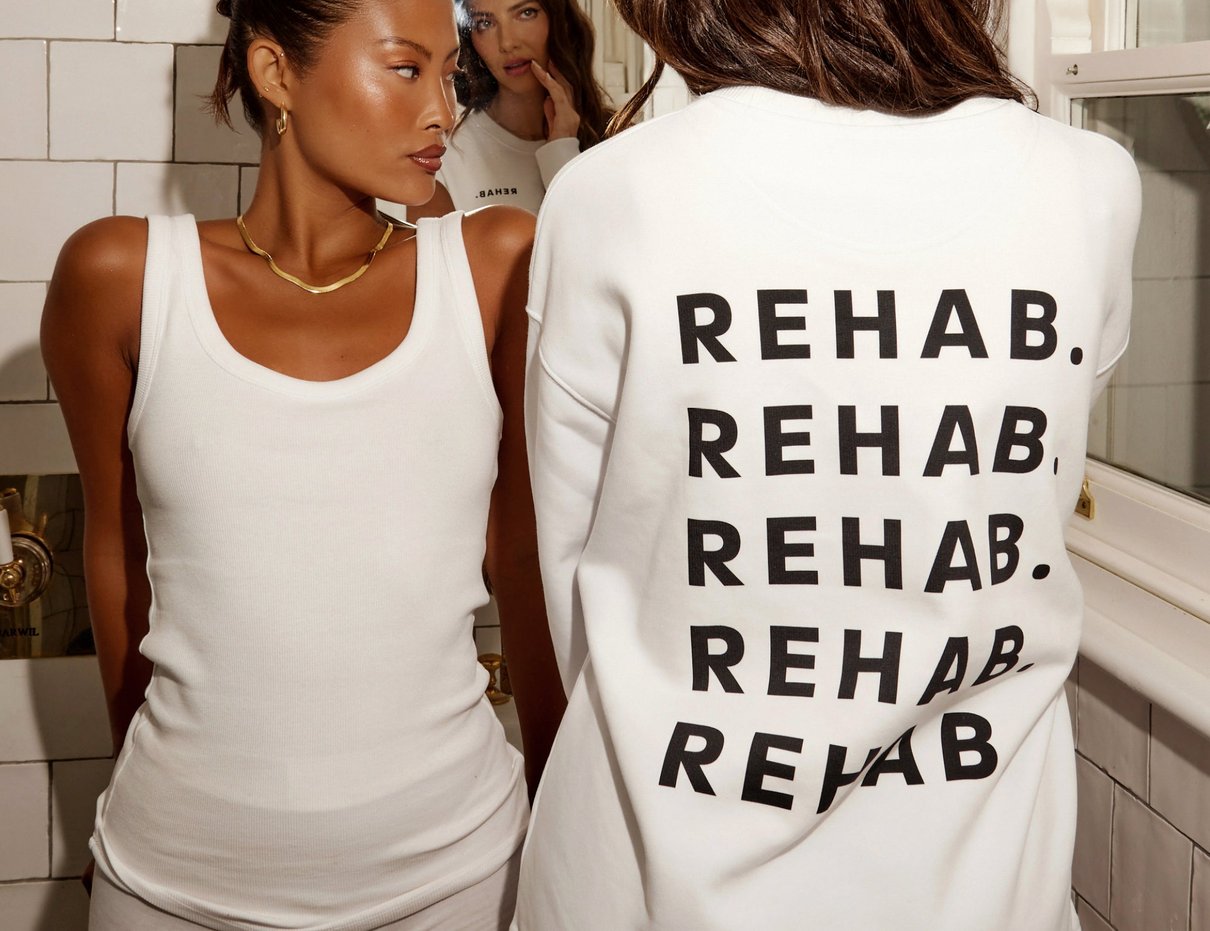 Person wearing REHAB Your Hair sweatshirt in a lifestyle scene