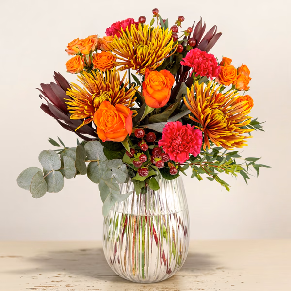 Mellow Autumn bouquet with orange roses and bronze chrysanthemums