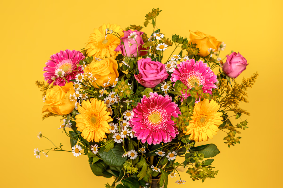 Summer Brights bouquet with yellow and pink germini and roses