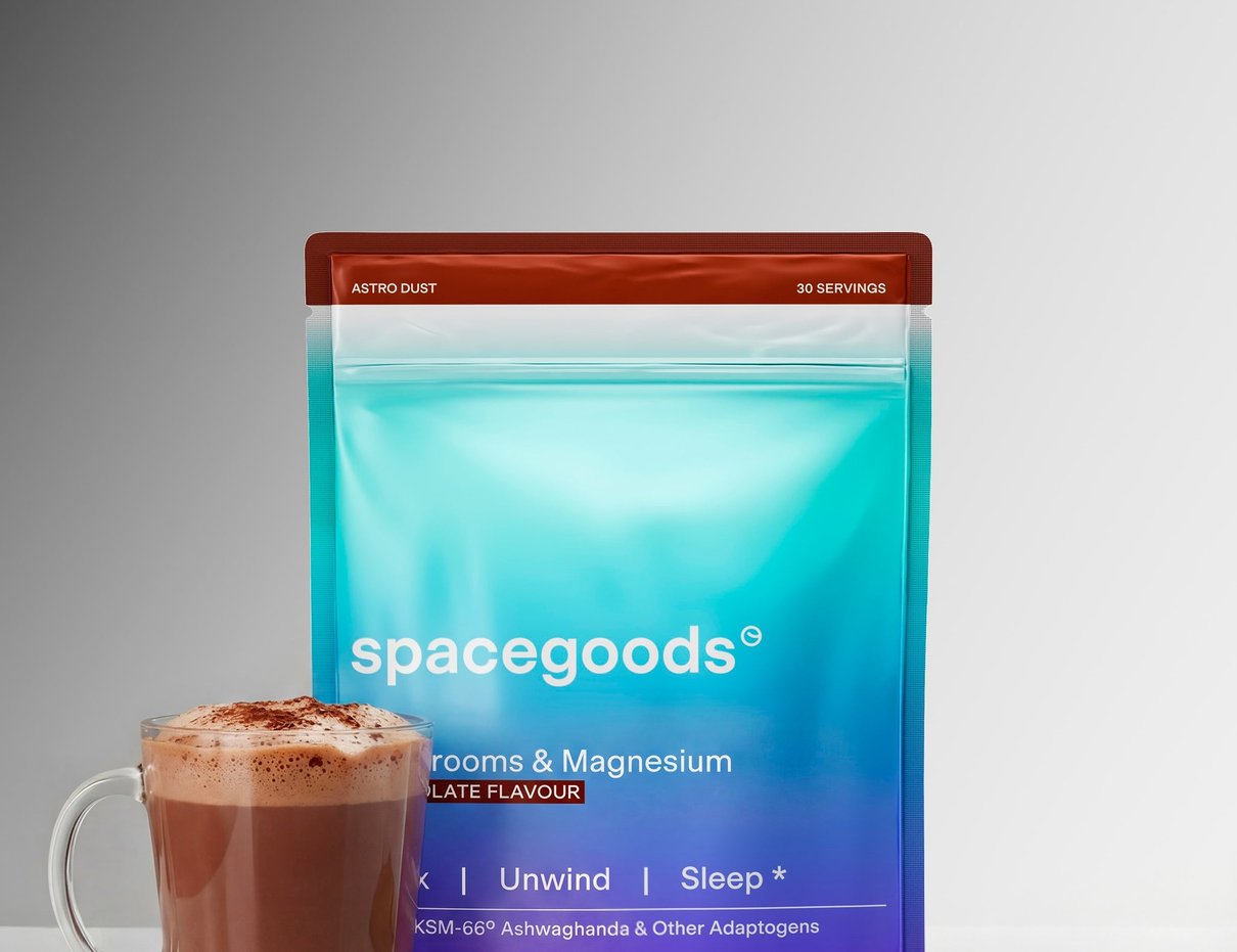 Astro Dust pouch beside a prepared drink