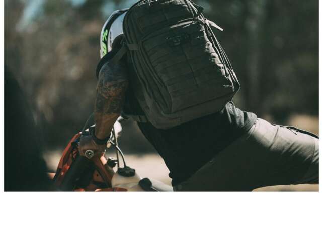5.11 RUSH24 2.0 Backpack shown in an outdoor use scene